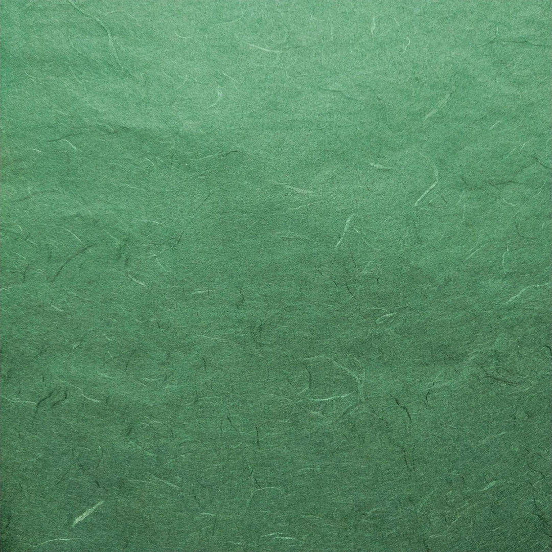 Detail of Kozo Studio's Unryu mulberry paper in green hues, showcasing the organic texture and artisanal quality of handmade paper.
