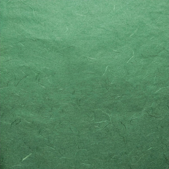 Detail of Kozo Studio's Unryu mulberry paper in green hues, showcasing the organic texture and artisanal quality of handmade paper.