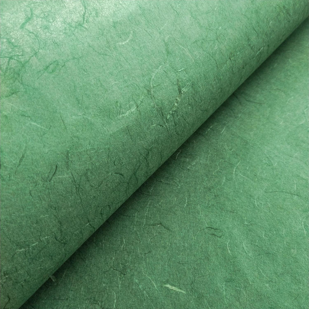 Textured surface of Amazon Green Unryu paper from Kozo Studio made from mulberry fibers, emphasizing the handmade paper's organic look.