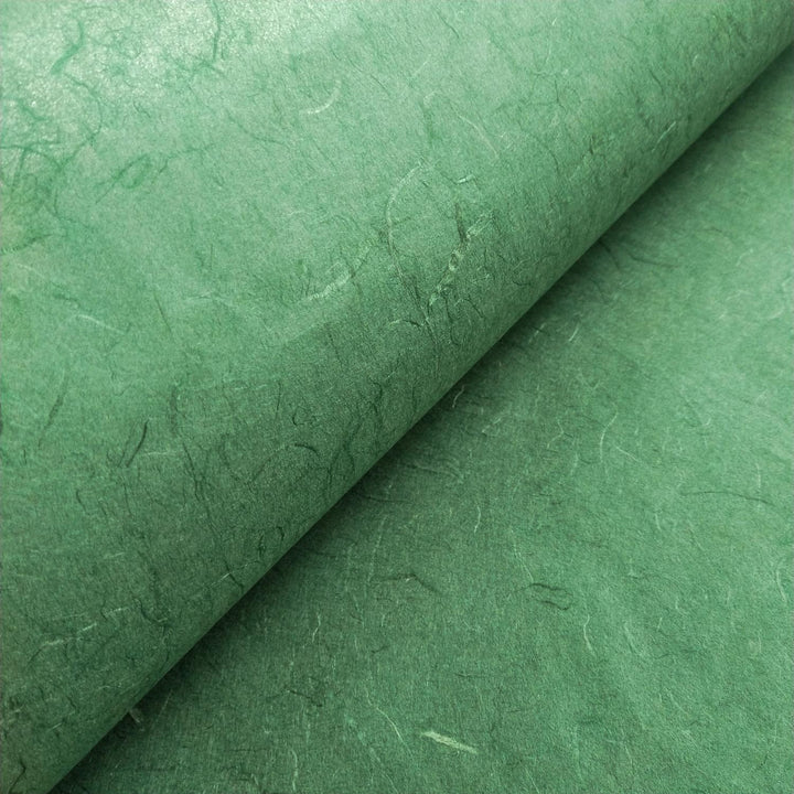 Textured surface of Amazon Green Unryu paper from Kozo Studio made from mulberry fibers, emphasizing the handmade paper's organic look.