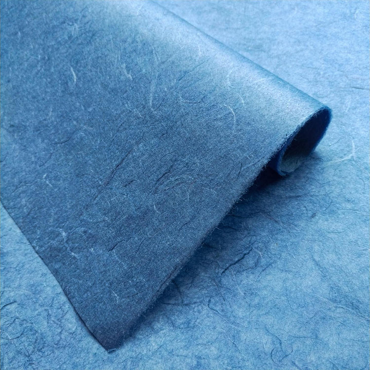 Handmade paper sheets in cobalt blue from Kozo Studio featuring Unryu-style mulberry fibers