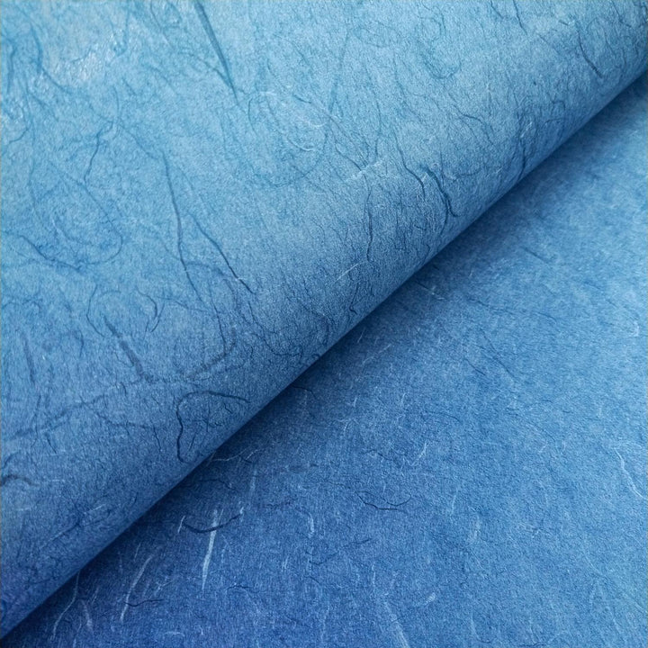 Fibrous texture of Kozo Studio cobalt blue Unryu mulberry paper captured in close detail