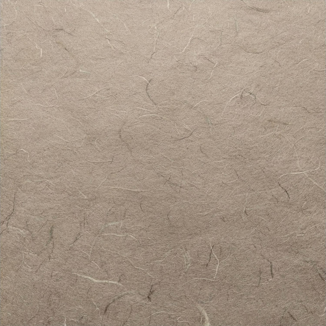 Detailed view of Kozo Studio Unryu mulberry paper in grey, highlighting natural fiber patterns and handmade quality.