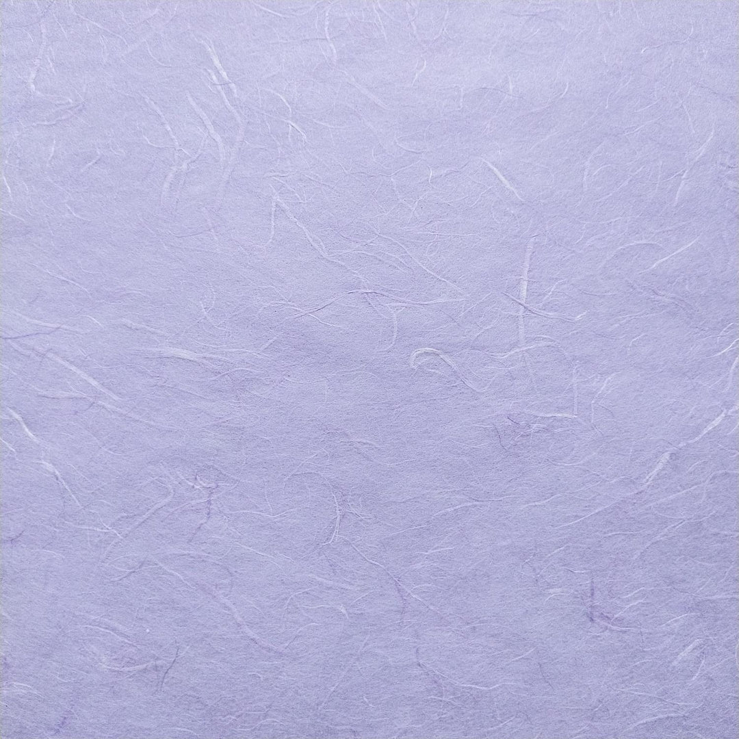 Detailed image of fibrous handmade paper by Kozo Studio, showing soft strands of mulberry fiber in layers of Unryu paper with a matte purple finish.