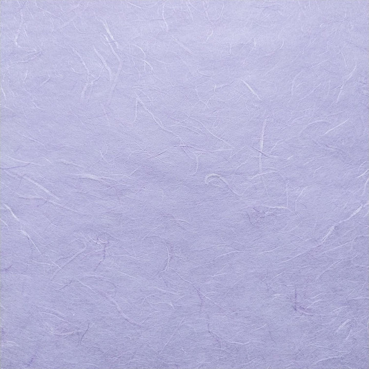 Detailed image of fibrous handmade paper by Kozo Studio, showing soft strands of mulberry fiber in layers of Unryu paper with a matte purple finish.