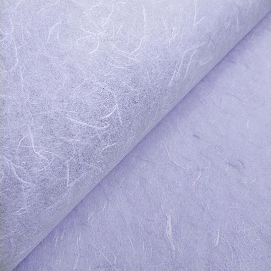 Unryu Kozo Studio mulberry paper in heather purple, featuring overlapping handmade sheets with delicate fiber patterns and natural texture.
