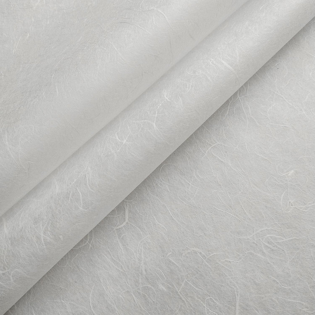 Close-up of Kozo Studio handmade paper in white Unryu style, showcasing the textured surface and natural mulberry fibers for a light, airy appearance.