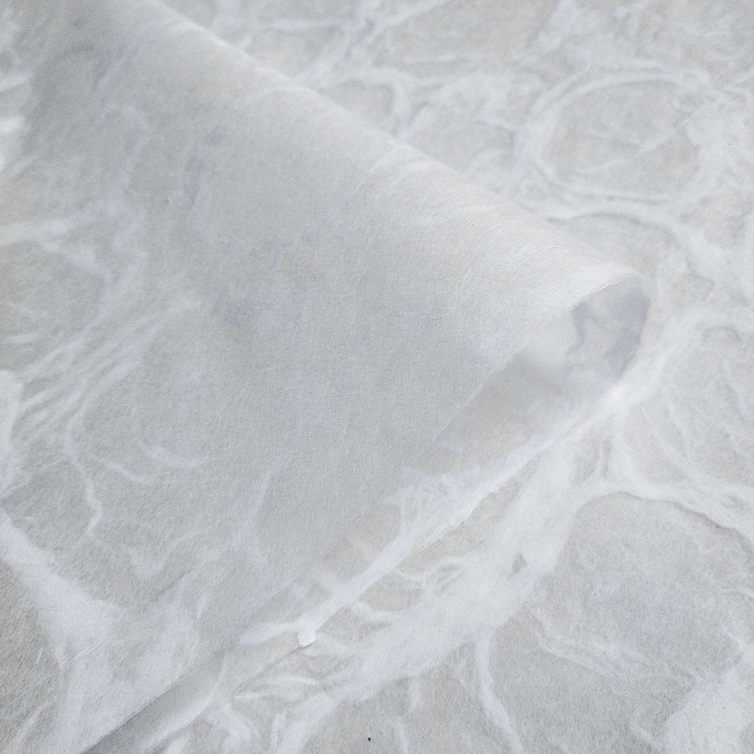 Elegant Ripple Kozo paper with a water ripple effect, made from high-quality mulberry fiber and crafted by Kozo Studio using traditional handmade paper techniques.