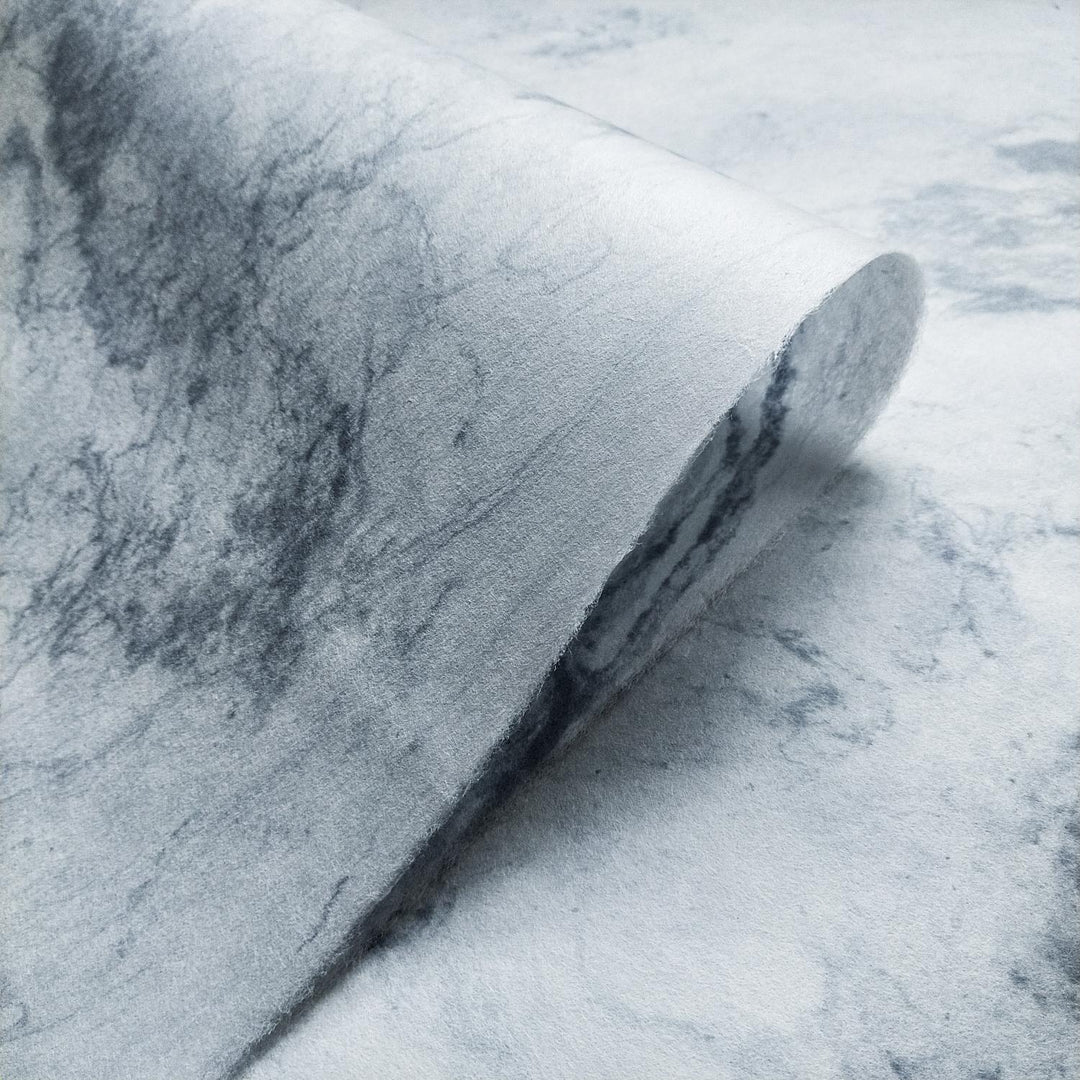 The Sky Kozo Paper Design 2 from Kozo Studio showcasing abstract marbled patterns in grey and white on elegant handmade mulberry paper.