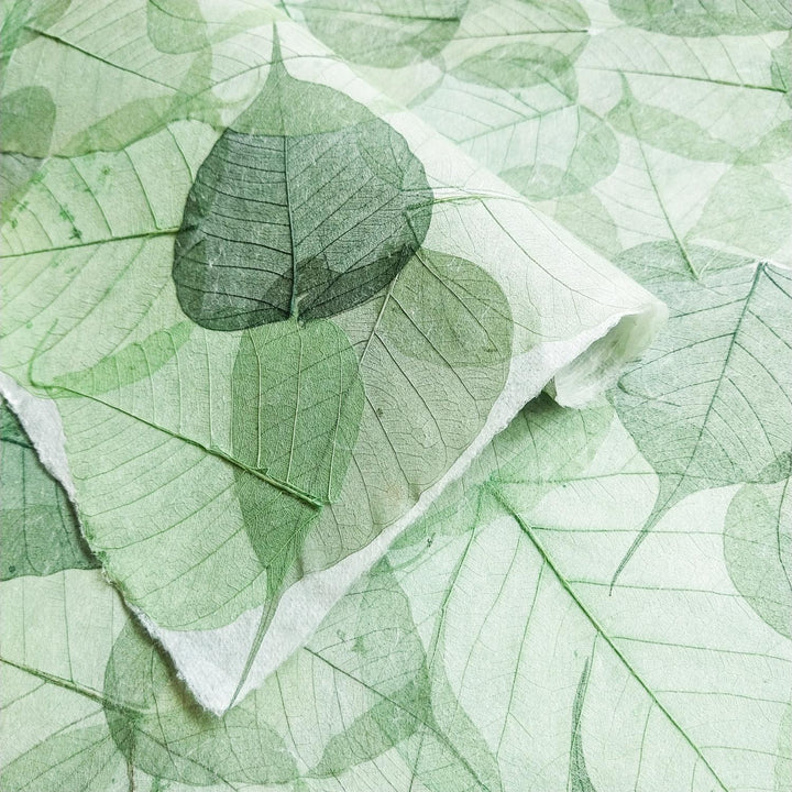 Elegant Kozo Studio mulberry paper with embedded Buddha leaves, showcasing traditional handmade paper aesthetics with a spiritual touch.