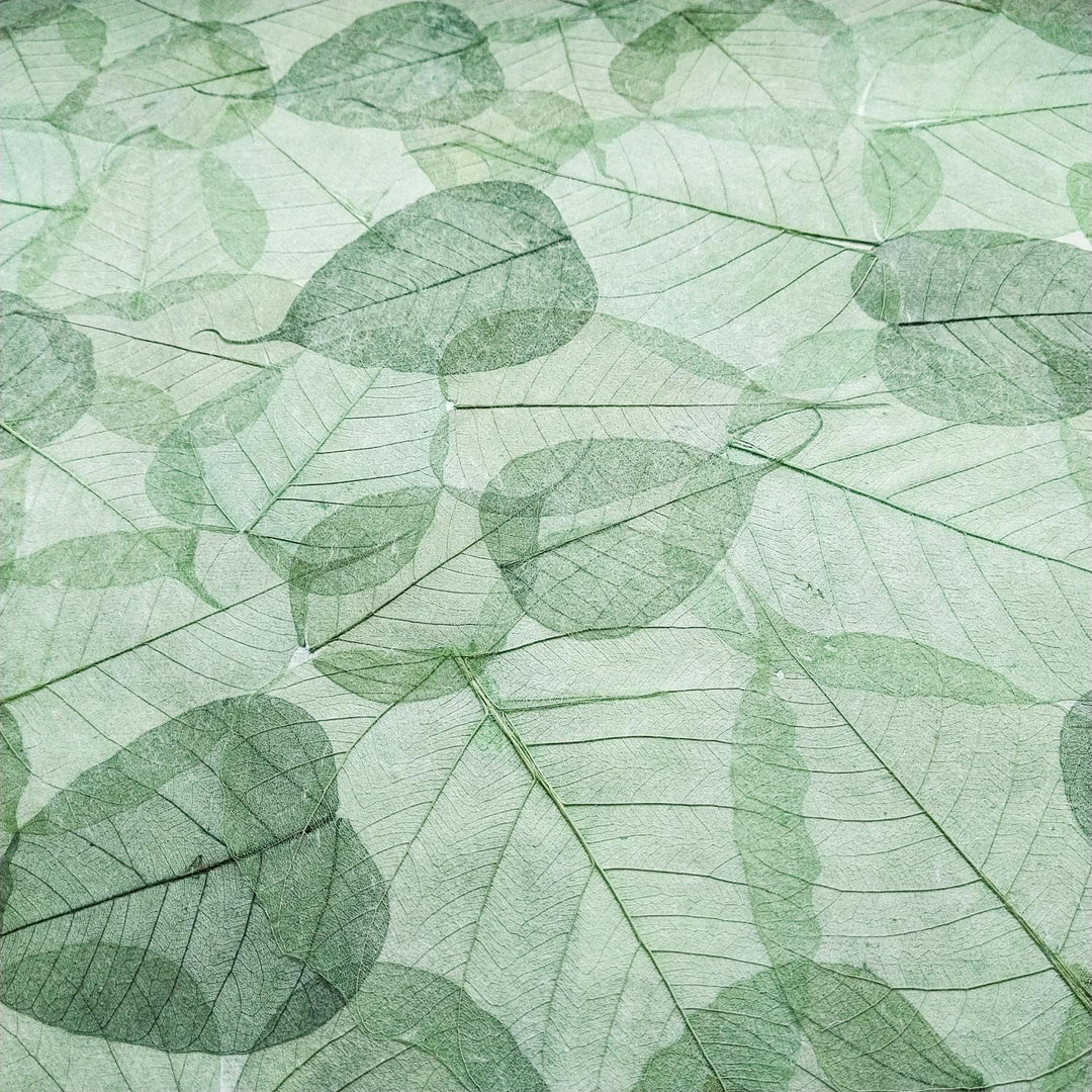 Durable and decorative handmade mulberry paper from Kozo Studio, adorned with symbolic bodhi leaves for art and gift projects.