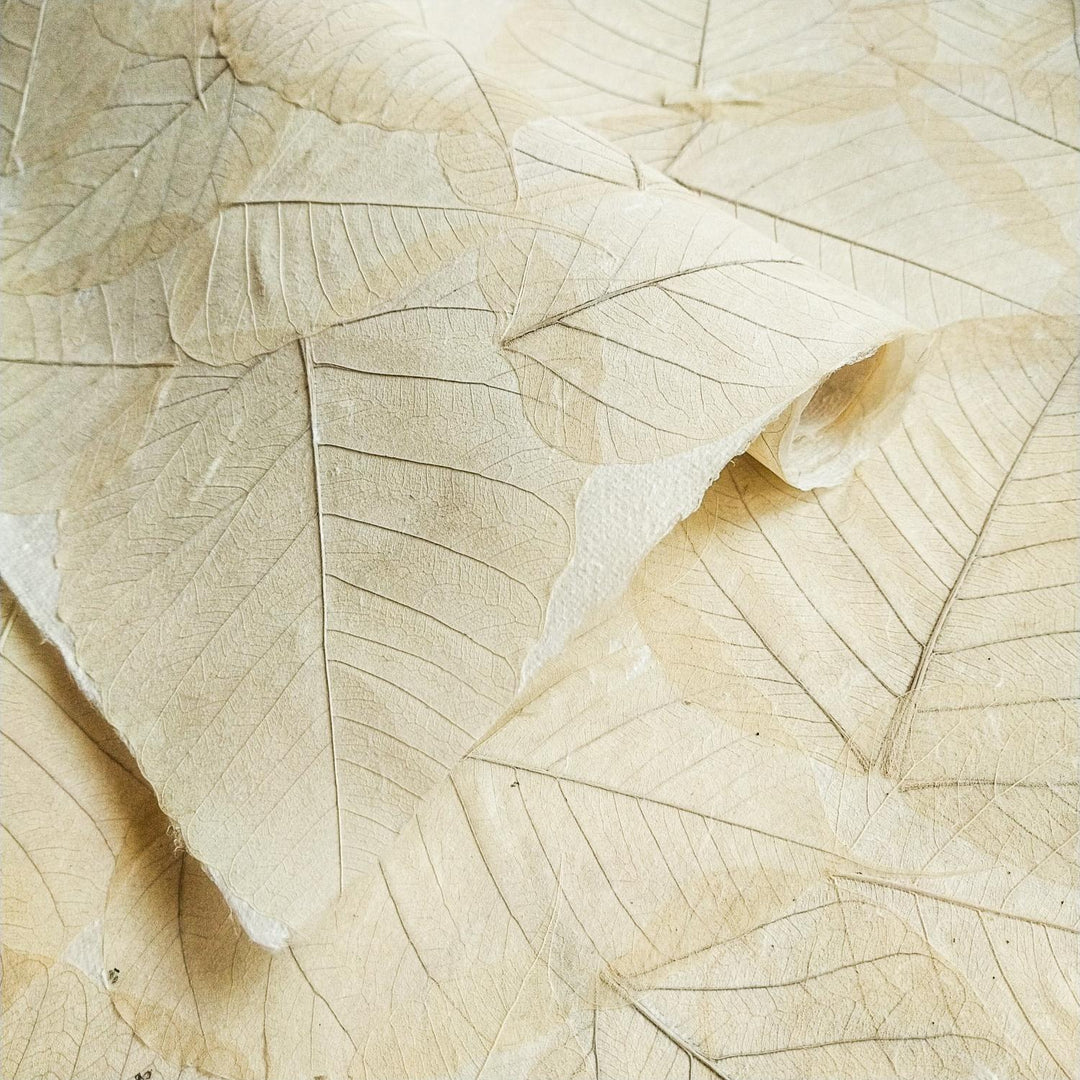 Medium-weight handmade paper by Kozo Studio with natural bodhi leaves pressed into durable mulberry paper, reflecting an authentic oriental aesthetic.