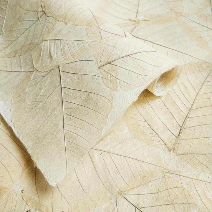Medium-weight handmade paper by Kozo Studio with natural bodhi leaves pressed into durable mulberry paper, reflecting an authentic oriental aesthetic.