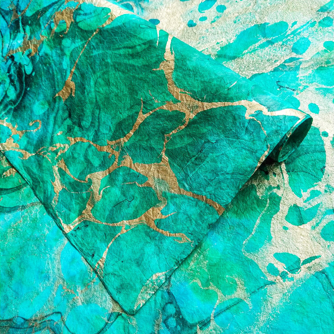 Decorative handmade paper by Kozo Studio showcasing a bold marbled pattern on soft, fabric-like mulberry paper surface.