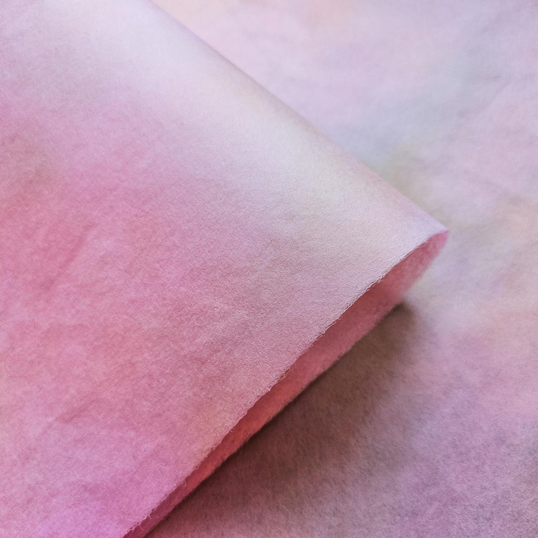 Hand-colored Ombre Paper by Kozo Studio in shades of blush and beige, crafted from premium mulberry paper, offering a sophisticated handmade texture for artistic use.