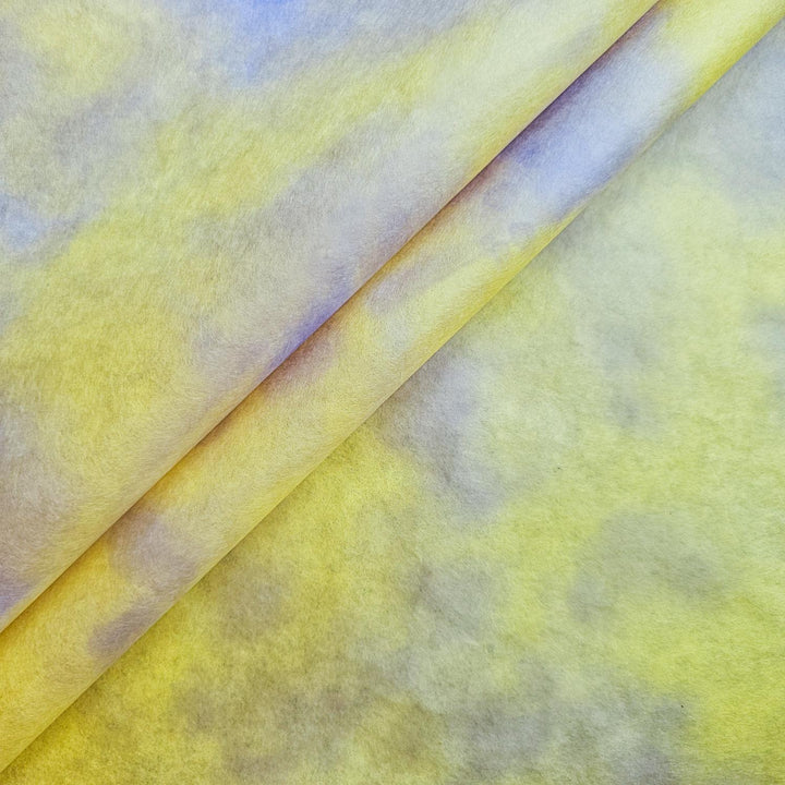Close-up of Ombre Kozo Mulberry Paper from Kozo Studio in Canary Glow, showcasing vibrant handmade paper with a smooth gradient blend of yellow and purple hues.