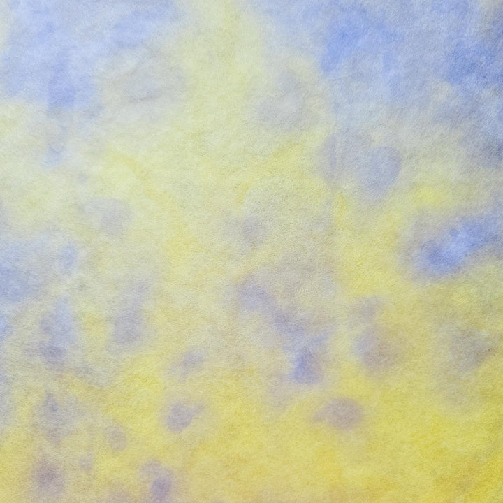 Detailed image of Kozo Studio’s Ombre Mulberry Paper in yellow and purple, capturing the fine handmade texture and subtle surface wrinkles characteristic of artisan craftsmanship.
