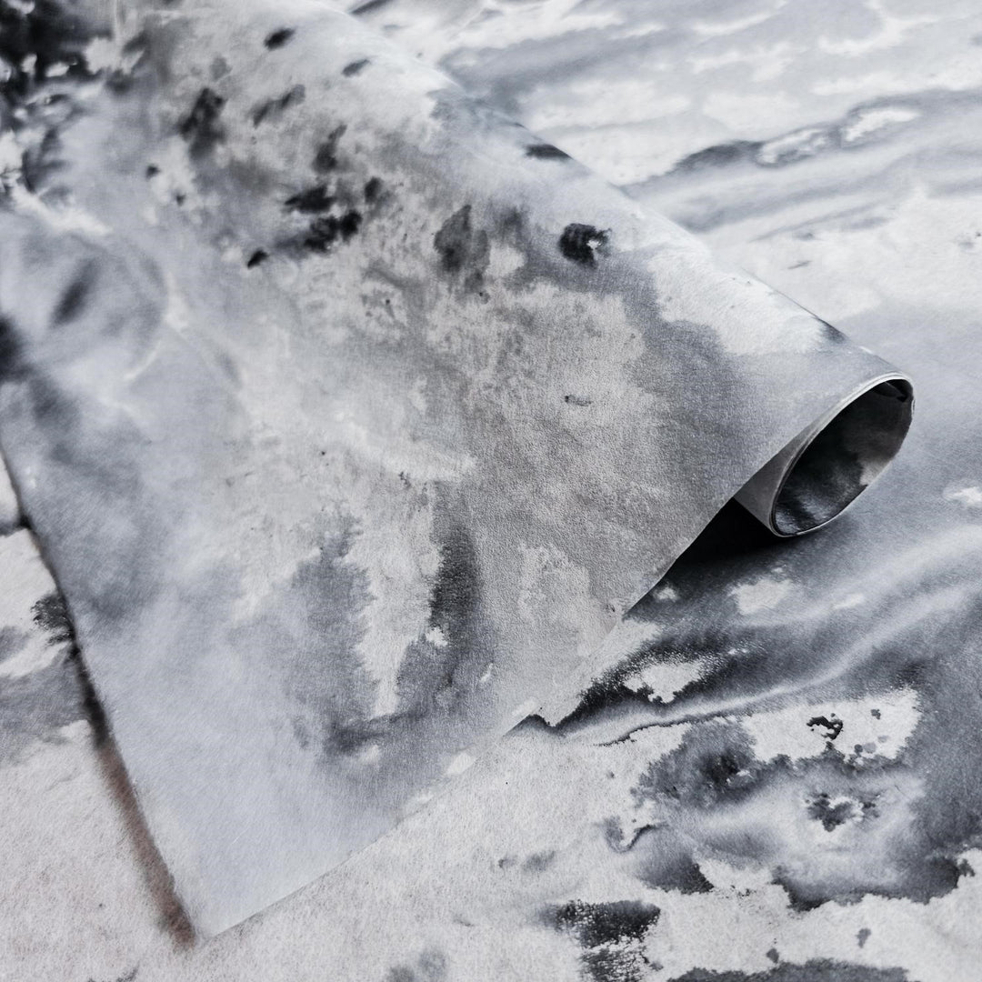 Handmade paper from Kozo Studio with a stunning black to white ombre effect, crafted from premium mulberry pulp and perfect for creative projects and crafts.