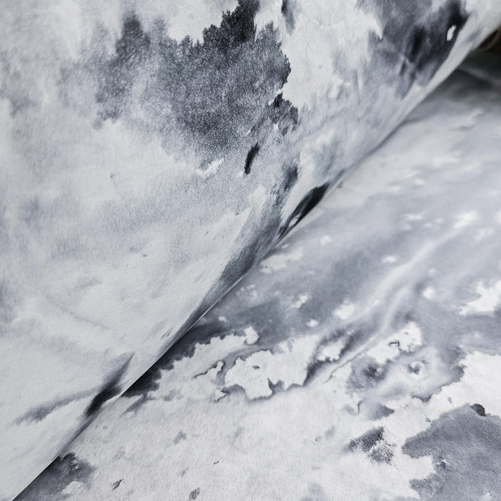 A close-up of Ombre Kozo Paper (#5 Inked Canopy) by Kozo Studio showcases abstract black and gray watercolor patterns on mulberry paper, creating a marbled effect with organic shapes and shades for a fluid, textured appearance.