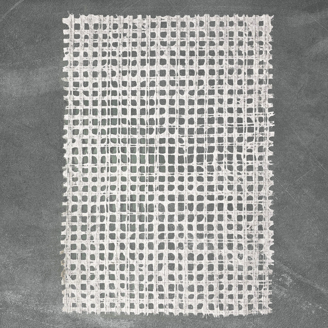Artisan-made white handmade paper from Kozo Studio, featuring a detailed glen plaid design on high-quality mulberry paper.