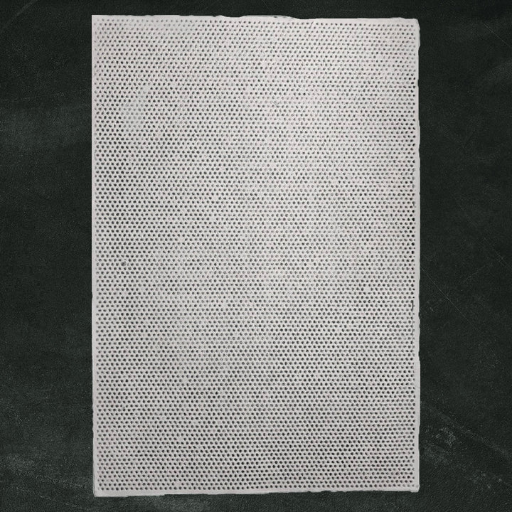 Close-up of Rakusui Technique on Handmade Paper by Kozo Studio – A fine example of mulberry paper crafted with the Rakusui method, showcasing intricate lace dots and translucent texture.
