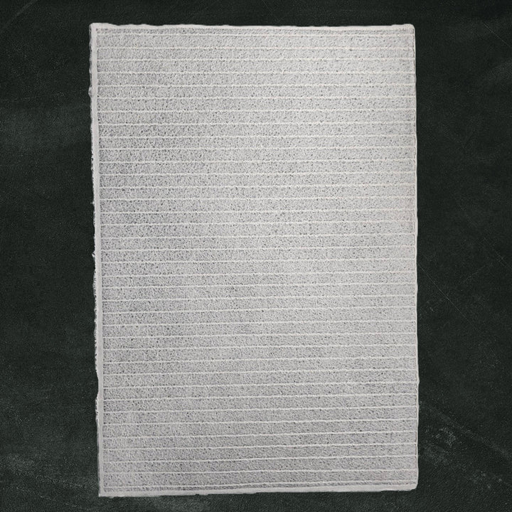 Textured white handmade paper created by Kozo Studio, featuring intricate lace stripes made from mulberry pulp with the Rakusui water-displacement method for unique design and transparency.