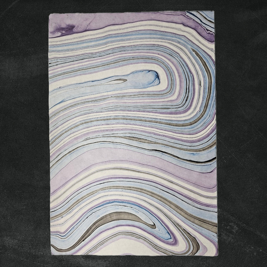 Detailed view of Marble Kozo handmade paper with a unique marbled pattern by Kozo Studio, highlighting the texture of premium mulberry paper.