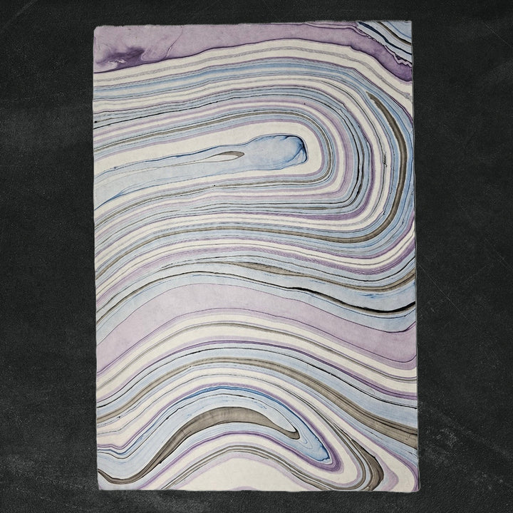 Detailed view of Marble Kozo handmade paper with a unique marbled pattern by Kozo Studio, highlighting the texture of premium mulberry paper.