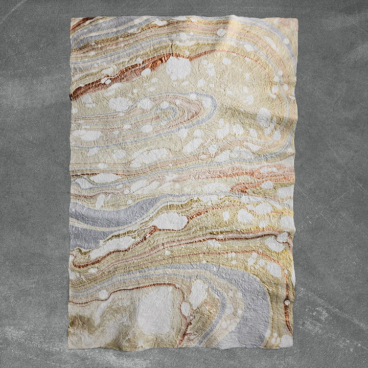 Artistic sheet of handmade paper from Kozo Studio featuring Milano Kozo Paper – Design 10, created by layering mulberry paper over oil-based swirls for a one-of-a-kind look.