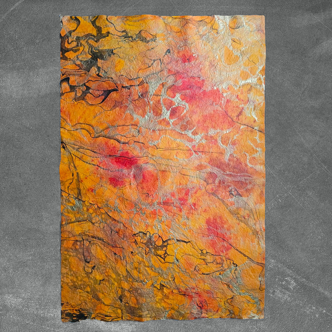 Milano Kozo Paper – Design 7 from Kozo Studio displays fiery tones and metallic veins on soft mulberry paper, perfect for artistic or decorative use.