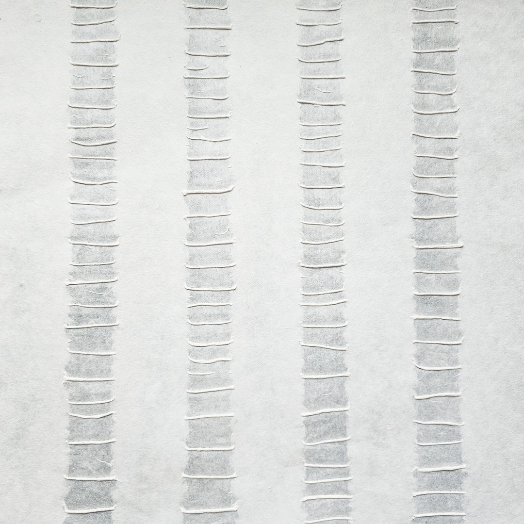 Kozo Studio handmade paper in white, featuring a tactile mulberry surface with evenly spaced stripes and a unique handcrafted texture.