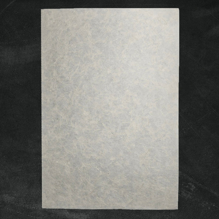 Detailed view of Mikado Kozo mulberry paper crafted by Kozo Studio, featuring natural hemp strands and a flexible, elegant handmade paper texture.