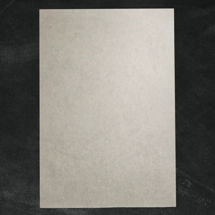 Textured handmade paper made with sugarcane and kozo pulp from Kozo Studio, featuring a lightly fibrous, artisanal finish perfect for crafts.