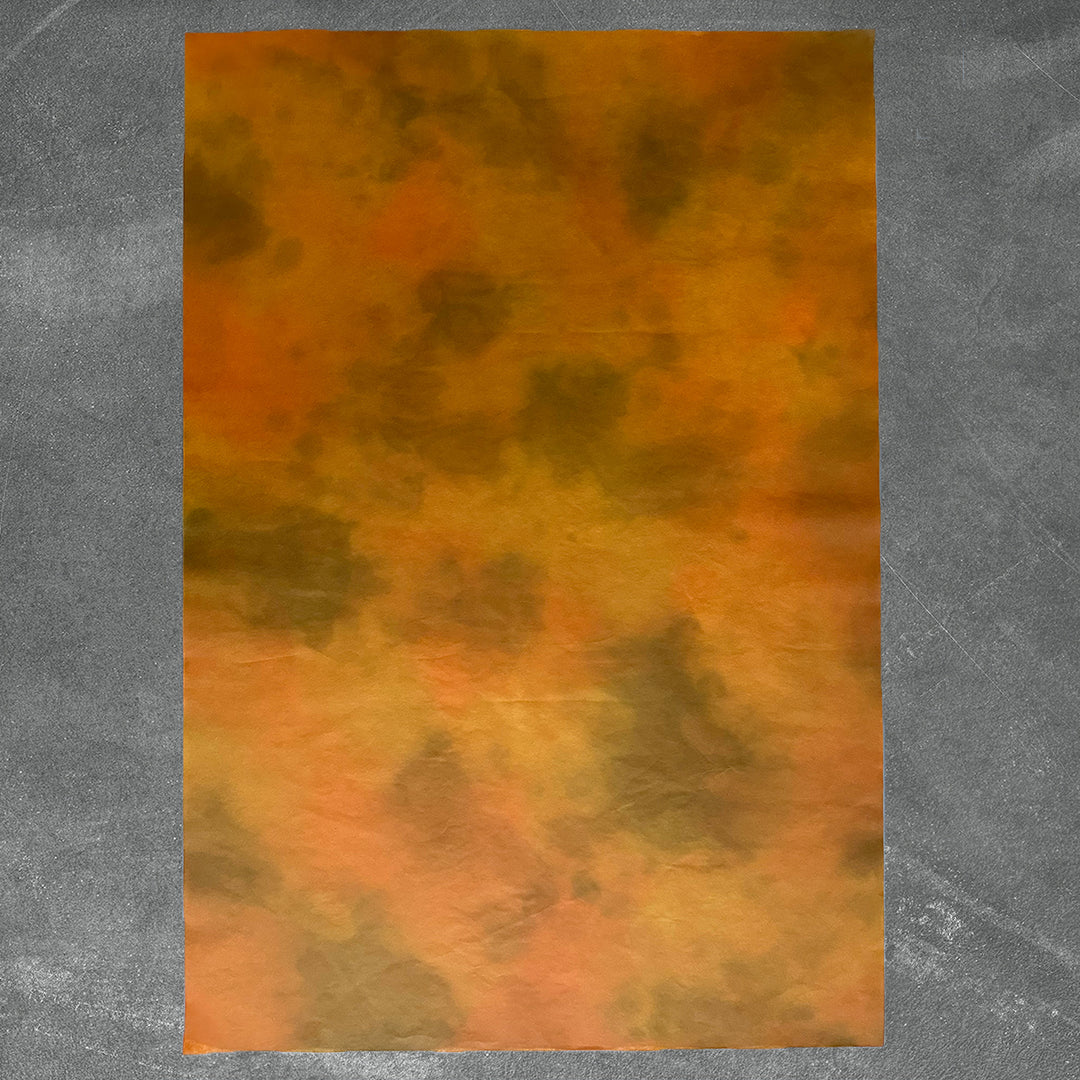 Amber Dawn ombre mulberry paper by Kozo Studio showcasing warm orange and brown hues, perfect for elegant handmade paper crafts and décor projects.