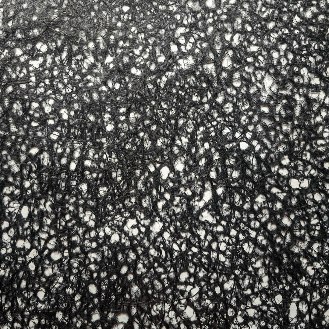Black handmade mulberry paper crafted using the Rakusui technique at Kozo Studio, featuring delicate water-formed patterns and strong kozo and abaca fibers.