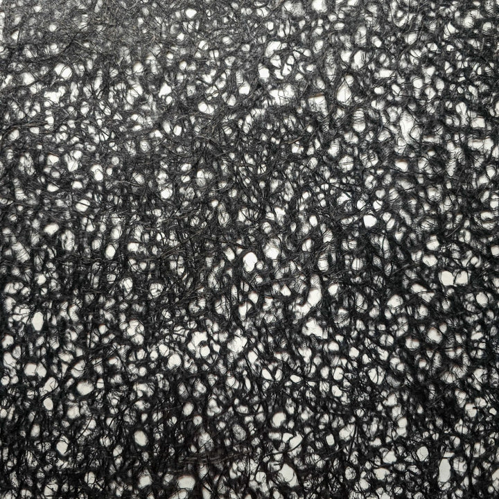 Black handmade mulberry paper crafted using the Rakusui technique at Kozo Studio, featuring delicate water-formed patterns and strong kozo and abaca fibers.
