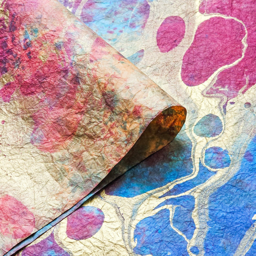 Colorful handmade mulberry paper artwork by Kozo Studio, Milano Design 6, showing intricate marbling with bold hues and a distinctive crumpled finish.