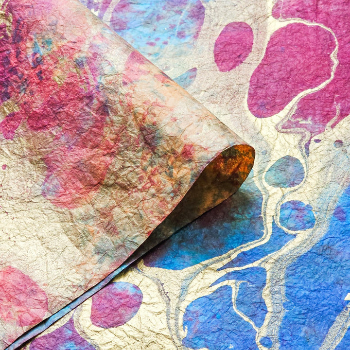 Colorful handmade mulberry paper artwork by Kozo Studio, Milano Design 6, showing intricate marbling with bold hues and a distinctive crumpled finish.