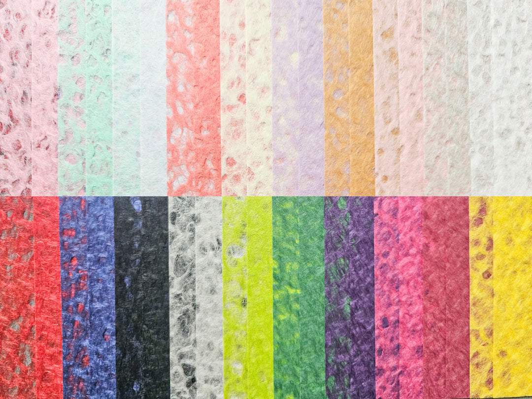 The Kozo Studio Assorted A4 Rakusui Mulberry Paper Set (40 Sheets) features textured, fibrous, Handmade-style sheets in various colors inspired by the Rakusui technique—ideal for decorative crafts and creative projects.