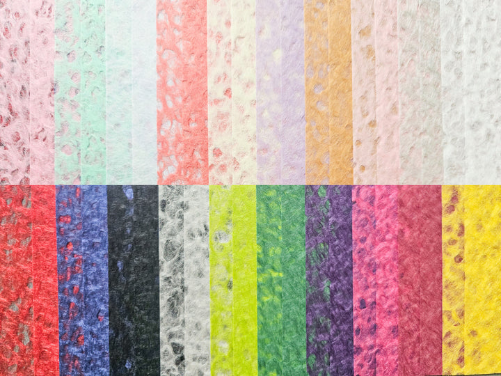 The Kozo Studio Assorted A4 Rakusui Mulberry Paper Set (40 Sheets) features textured, fibrous, Handmade-style sheets in various colors inspired by the Rakusui technique—ideal for decorative crafts and creative projects.