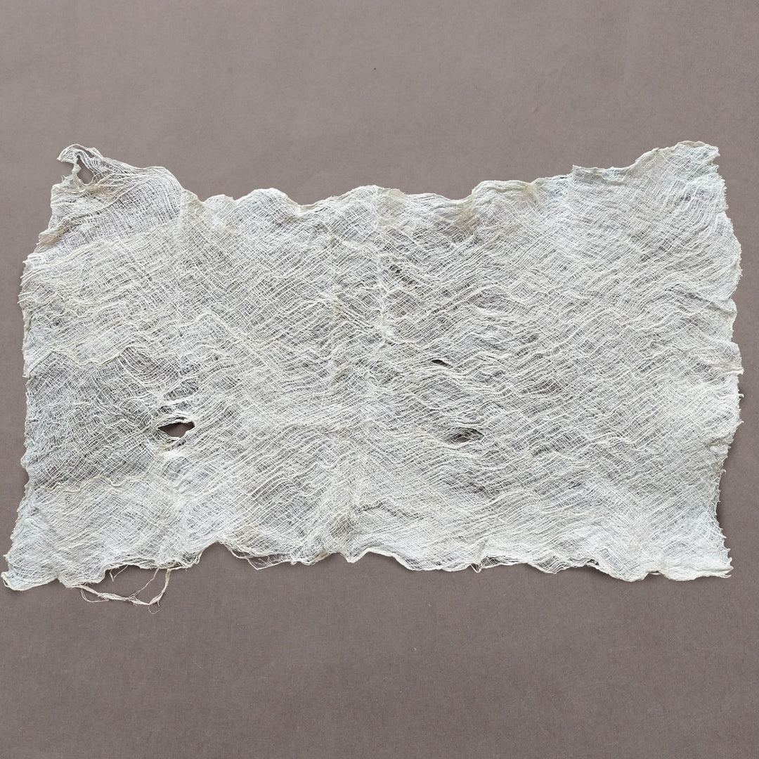 Kozo Studio mulberry bark sheet laid flat, highlighting the fibrous weave, variable shades, and organic appeal perfect for fine art applications.