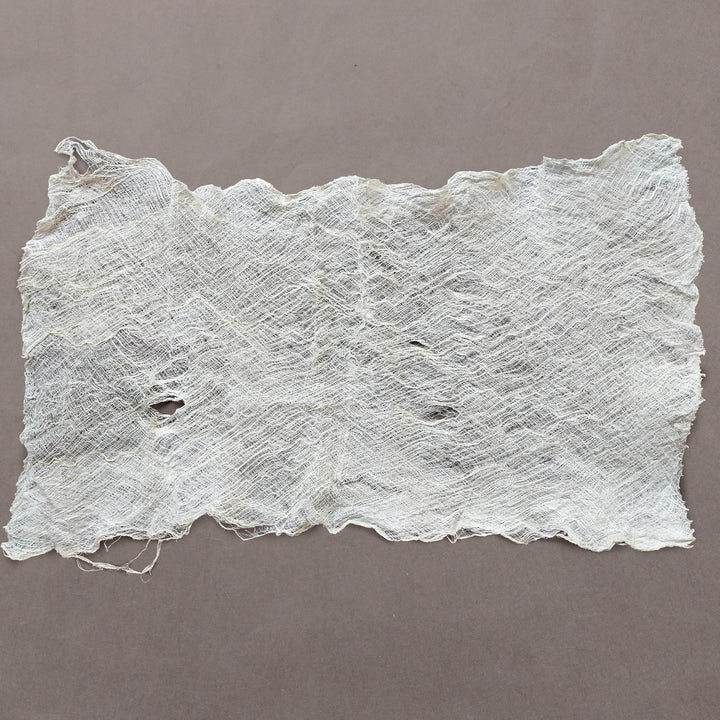 Kozo Studio mulberry bark sheet laid flat, highlighting the fibrous weave, variable shades, and organic appeal perfect for fine art applications.