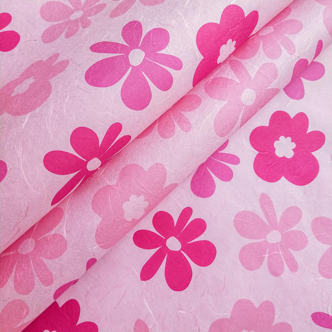 Close-up of Caribbean-inspired pink and fuchsia floral patterns on handmade mulberry paper by Kozo Studio, featuring bold flower prints and vibrant tropical colors.