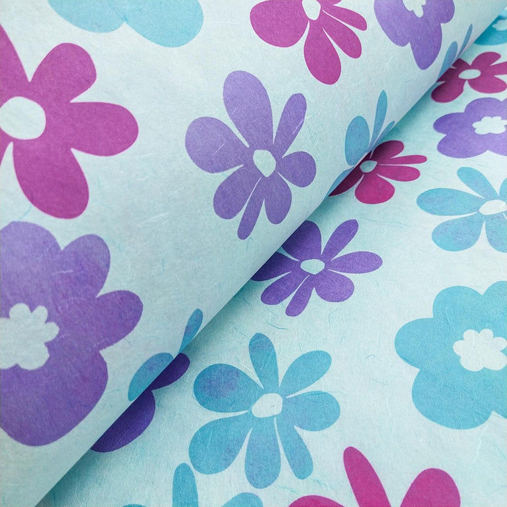 Vibrant Kozo Studio screen-printed mulberry paper with handmade quality, layered with Caribbean floral motifs in pink, purple, and blue.