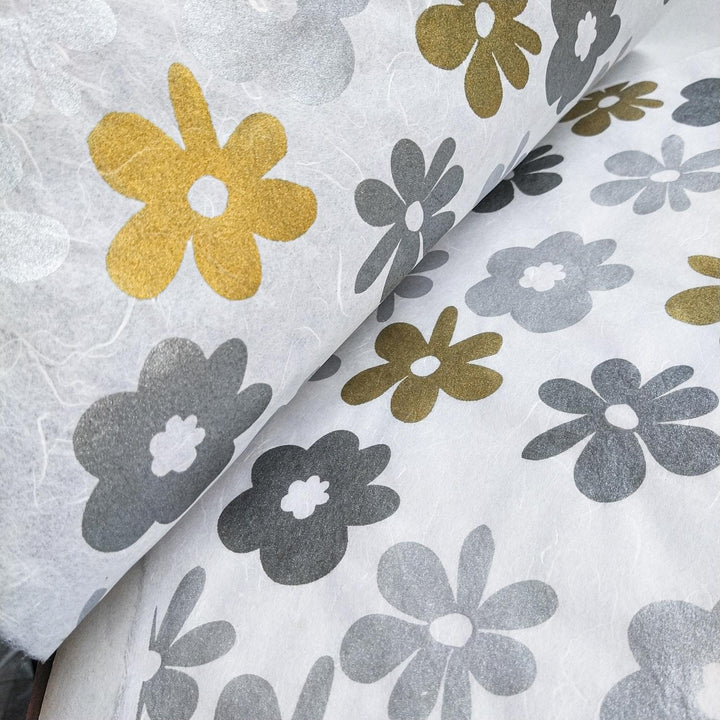 Kozo Studio's screen-printed handmade paper featuring a bold tropical flower pattern in metallic tones, beautifully displayed on textured mulberry paper.