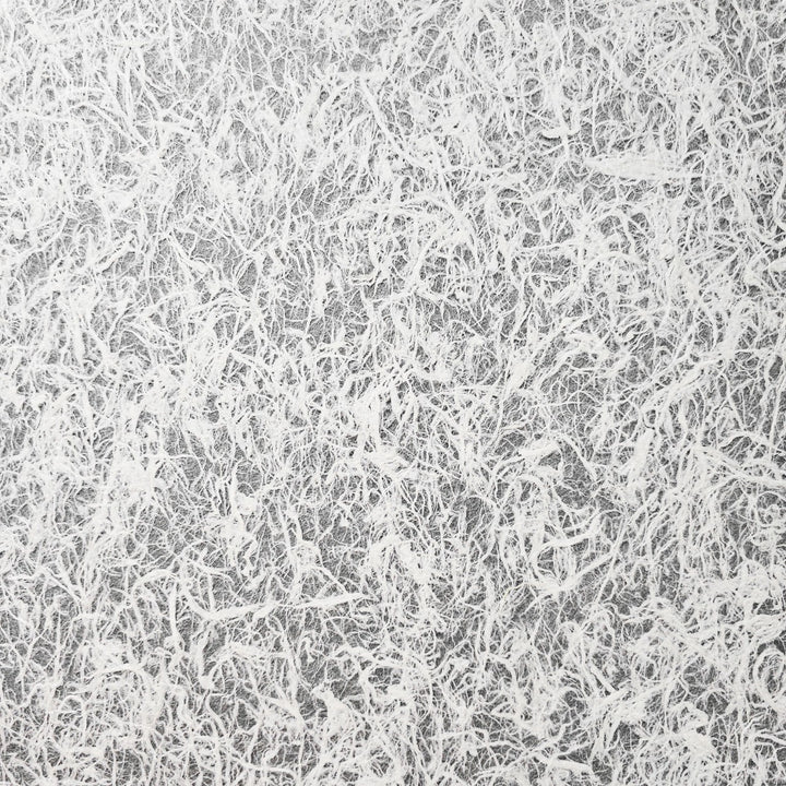 Close-up of strong yet delicate Kozo Studio mulberry paper with visible natural fibers, used in high-end crafts and artistic design projects.