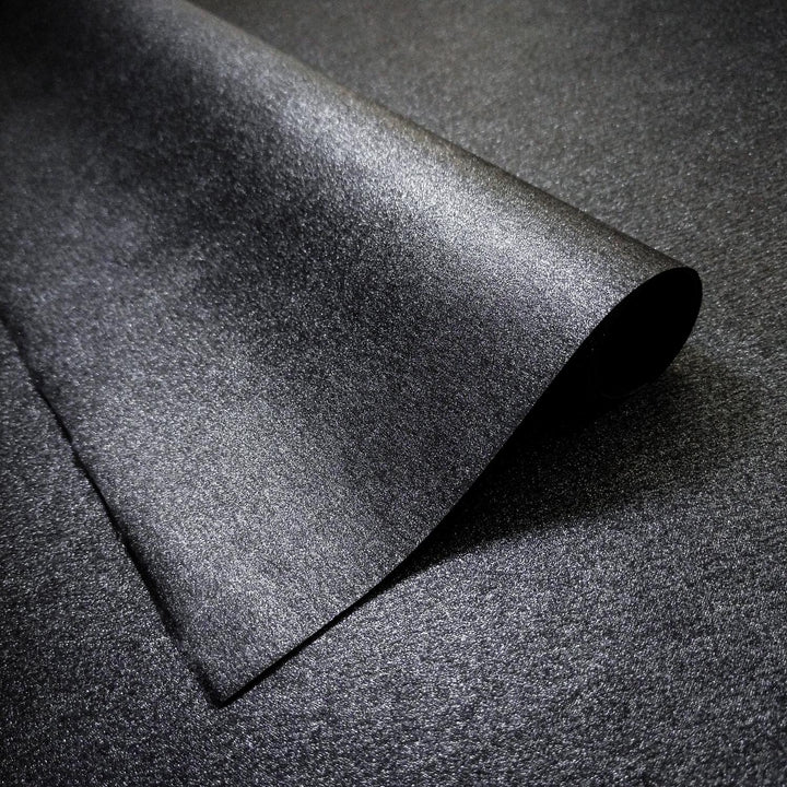Close-up of Gleaming Metallic Kozo Paper in black by Kozo Studio, a luxurious handmade mulberry paper with a shimmering metallic surface and subtle kozo texture.