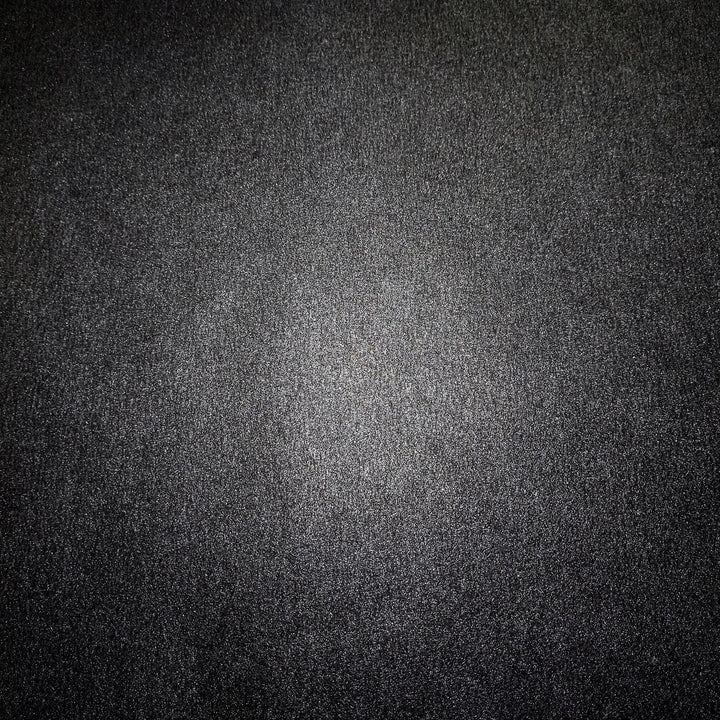 Black metallic mulberry paper sheet from Kozo Studio, featuring a refined handmade paper texture with sparkling highlights that enhance its elegant design quality.