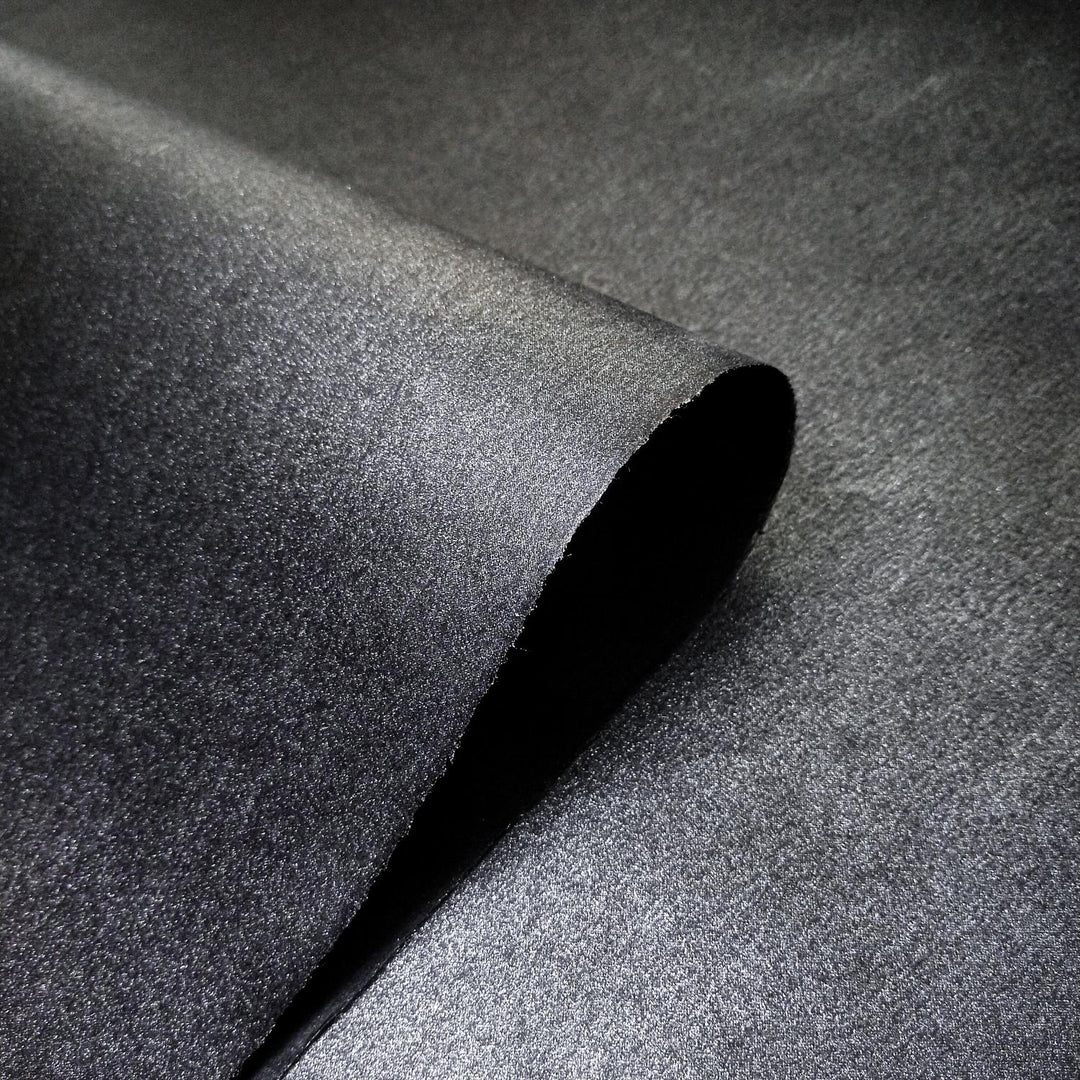 Sheet of premium black mulberry paper by Kozo Studio, handmade from kozo fiber with a smooth, shimmering metallic surface and refined natural texture.
