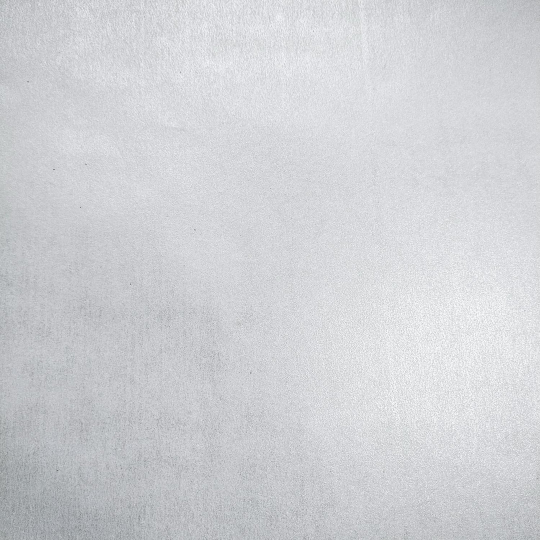 Close-up of Kozo Studio's Gleaming Metallic mulberry paper with a reflective pearl finish and delicate handmade paper texture ideal for luxurious crafts.